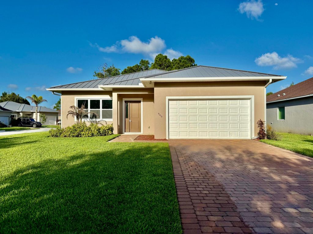 Photo of 660 NE Moss Rose Place, Port Saint Lucie, FL 34983 (MLS # B26034628)