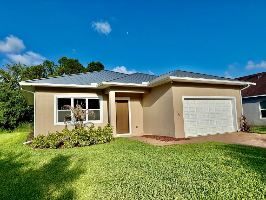 Photo of 660 NE Moss Rose Place, Port Saint Lucie, FL 34983 (MLS # B26034628)