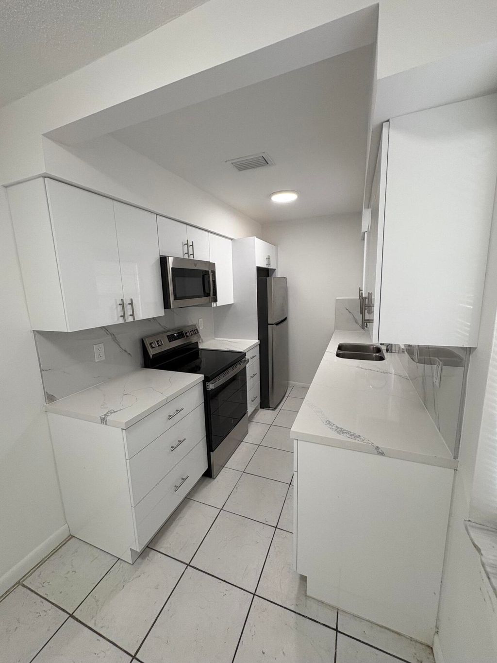 Photo of 4031 NW 30th Terrace #1, Lauderdale Lakes, FL 33309 (MLS # B26035318)