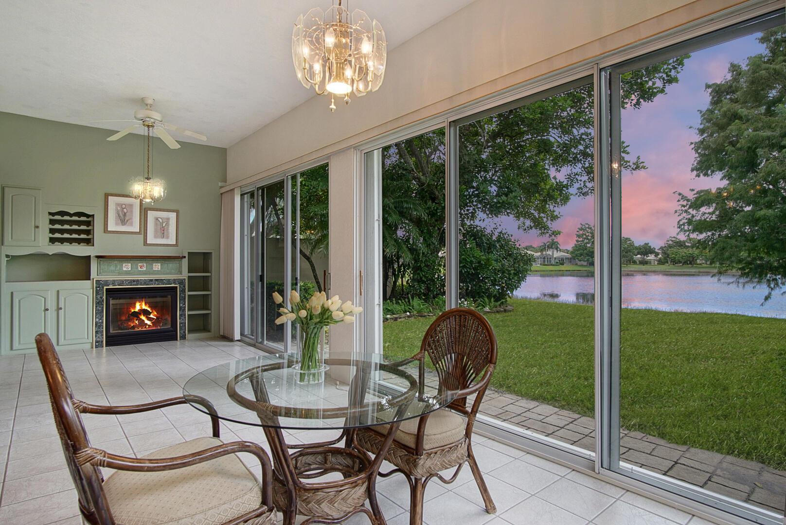 Relax looking out of this wide lake view in this freshly painted 3/2 with an enclosed Florida room. The Florida Room has a gas fireplace, sliders on all other walls and is situated for privacy. The primary BR has 3 closets allowing for mega storage. The kitchen has granite, extra cabinetry and a newer SS refrigerator. The front load, two car garage also has a newer small refrigerator. The living area has hardwood flooring, and the kitchen and baths have tile. The Lakes is close to everything in St. Lucie West: shopping, restaurants, golf, medical support and the Met's Stadium. The reasonable HOA fee includes lawn care, basic cable/internet and amenities like a pool & pickleball and tennis courts. This concrete Divosta home has accordion shutters. Come enjoy this comfortable home!