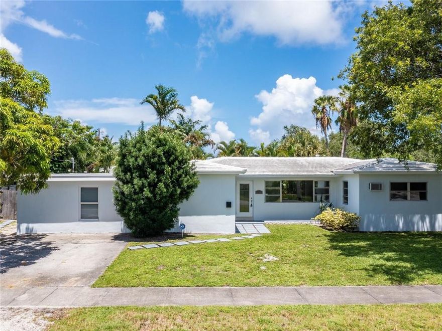 Corner lot. Well maintained Mid-Century home close to shopping/dining/beach. 3/3. Two nice sized bedrooms.  Huge Primary suite with large walk-in closet and extra bonus room. Office/den/games/sitting room.... Fenced back patio with heated below ground pool. Lots of out door space to enjoy the South Florida weather. Excellent condition original Terrazzo flooring in Large living/dining area and two of the three bedrooms. Freshly painted inside and out. Stainless steel appliances in open plan kitchen. Central A/C. This home is just west of US-1 in Poinsettia Heights neighborhood.