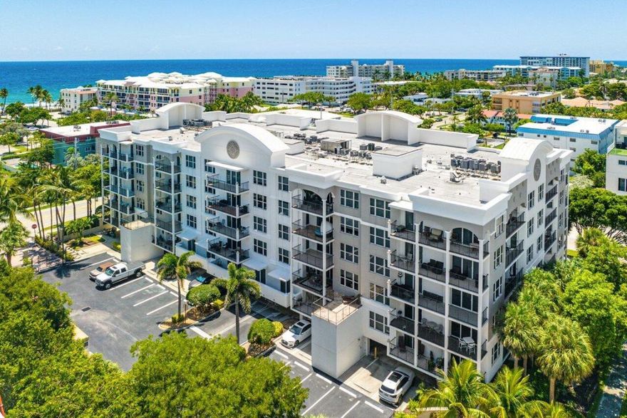 Deerfield premier condominium at 1 Ocean Blvd. This lower Southeast Penthouse corner condo features three full bedrooms, 2.5 baths and located in the heart of Downtown Deerfield. One block to the beaches or one block west to the intracoastal. Enjoy ocean views from the Master, living, family room and expansive double terrace. Upgrades throughout include a chef's kitchen with modern appliances, coastal design, laminated wood plank floors, his and her walk-in closets and master bath with dual sinks, jacuzzi and shower. Impact windows and sliding glass doors throughout. Community offers a private gate, pool, bbq and a gym. One deeded parking spot #158. New buyers can lease out the residence the first year of ownership. Two pets allowed. New building roof almost complete.