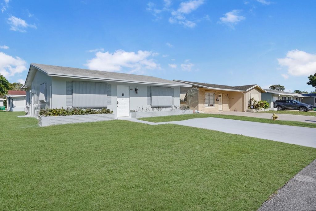 Photo of 7505 NW 58th St, Tamarac, FL 33321 (MLS # F10518344)