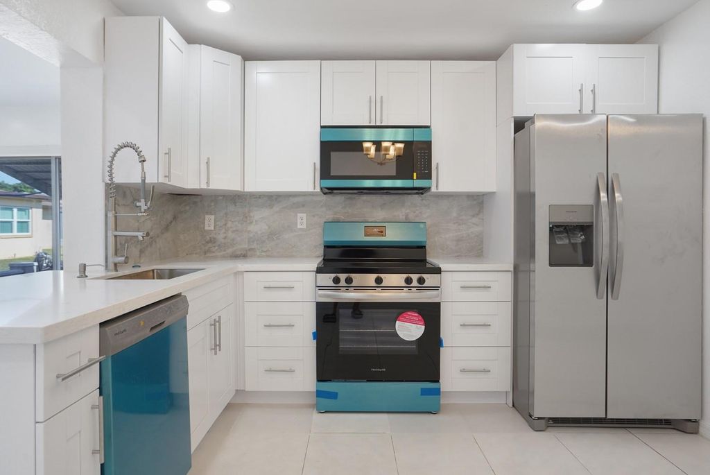 Photo of 7505 NW 58th St, Tamarac, FL 33321 (MLS # F10518344)