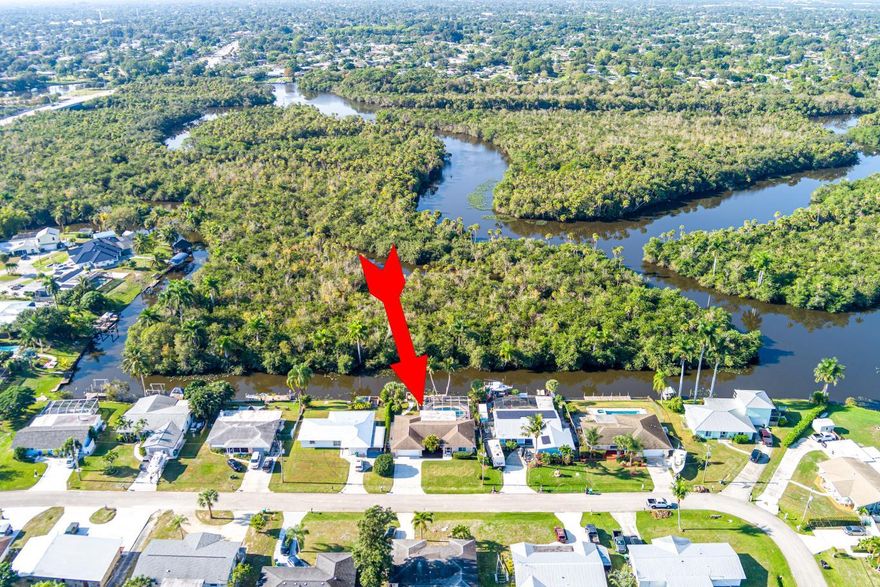 WOW !
Old Florida backyard oasis...Enjoy sunset cruises on the North Fork of the St. Lucie river ,relax on the screened patio ,your very own dock or have a refreshing dip in your private, newly resurfaced POOL.County taxes only .This 3/2/2 CBS pool home has a new roof,drainfeild ,paint ,and impact windows. Great palms and spectacular real Florida views and sunsets.

*All room sizes are approximate and shall be verified