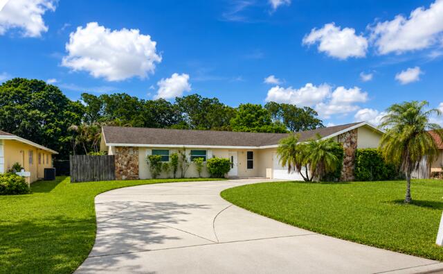 Photo of 113 Sandpiper Avenue, Royal Palm Beach, FL 33411 (MLS # B26038067)