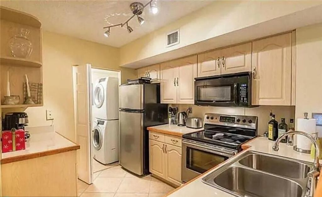 Photo of 3854 Lyons Road #312-5, Coconut Creek, FL 33073 (MLS # B26018208)