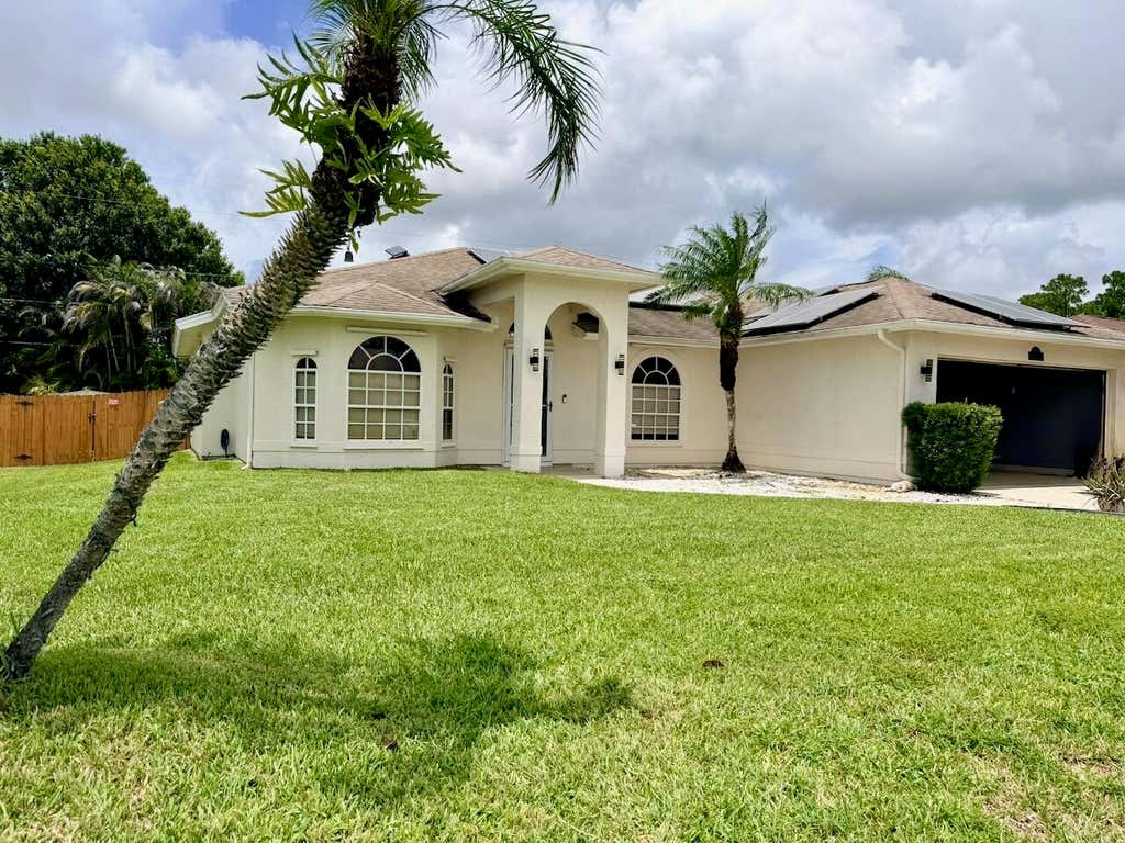 Photo of 1978 SW Hillman Street, Port Saint Lucie, FL 34953 (MLS # B26061469)