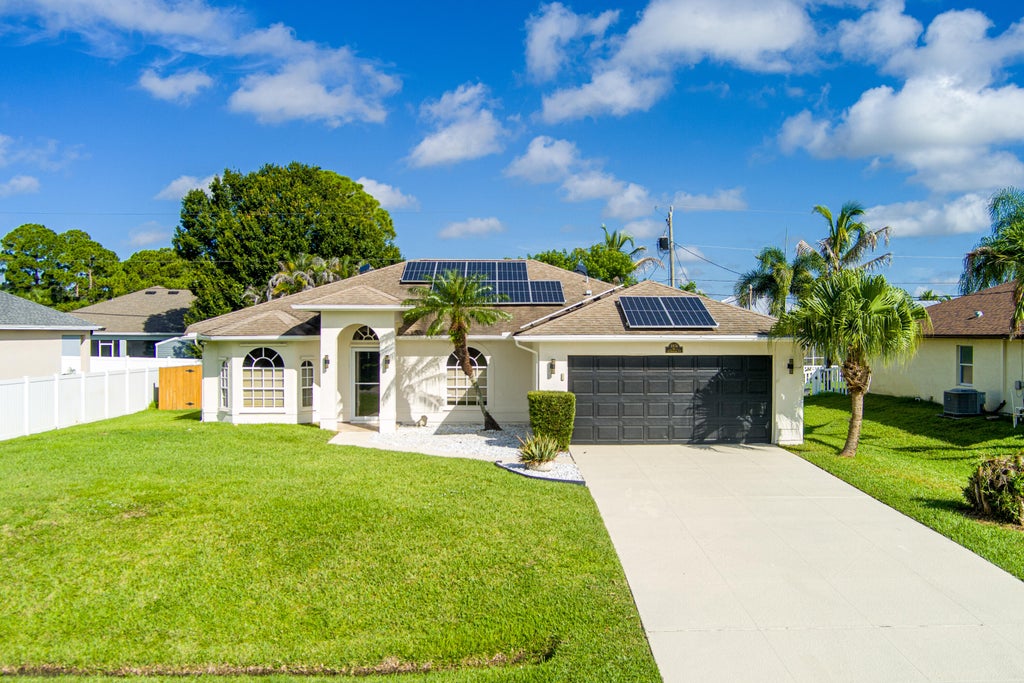 Photo of 1978 SW Hillman Street, Port Saint Lucie, FL 34953 (MLS # B26061469)
