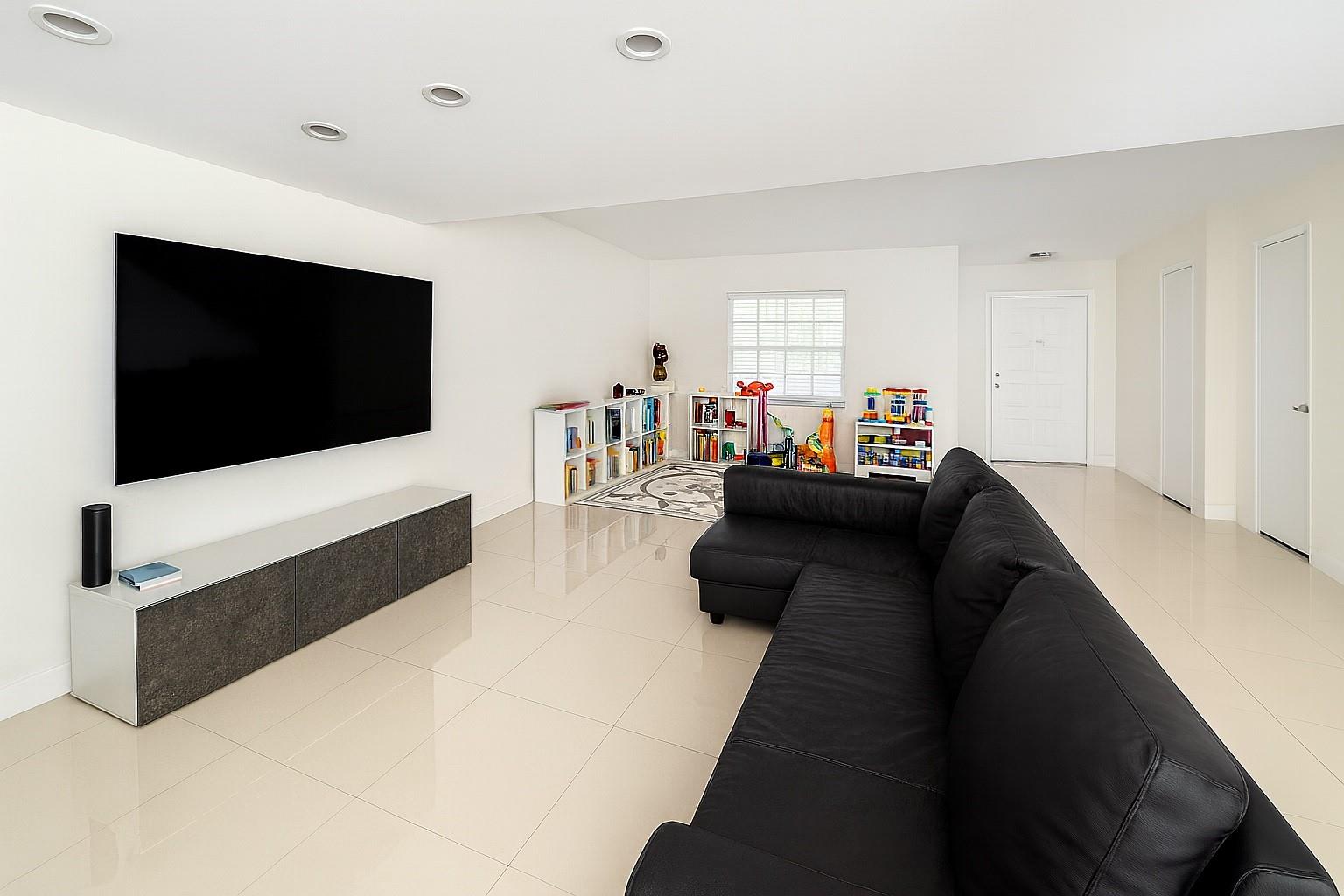 Welcome to this beautifully remodeled townhouse in Venetian Park East, just moments from the sand and ocean breeze. Upstairs, you’ll find two comfortable bedrooms, a versatile den that can easily serve as a third bedroom, and two full bathrooms. Designed with style and comfort in mind, this home features a modern open-concept kitchen with granite countertops, stainless steel appliances, and a sleek glass backsplash that adds elegance.
The spacious living area is highlighted by a custom-designed staircase of wood and glass with built-in lighting — a true centerpiece of the home.
Community amenities include two tennis courts, a heated pool, clubhouse, fitness room, and a party room with full kitchen — all just steps from shopping, dining, entertainment, and a short walk to the beach.