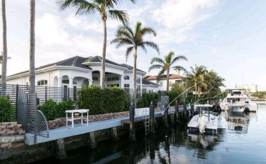 Stunning Deepwater home with 100 ft. of frontage in the intimate, and affluent boating community of Bel Lido Isle. Completely Recently remodeled from top to bottom, and immaculately presented, This home has been lavishly finished, and is bathed in natural light. You're steps away from the beach with private ''keyed'' entrance. It is a hidden gem noted the moment you pull into the newly designed paver driveway. Featuring Newer roof, Hurricane windows & Doors throught, w a 3 car garage! The coffered volume ceilings create a timeless style, and the lavish interior flows effortlessly with wall to wall 48'' Rectified porcelain flooring. Boasting a gourmet kitchen slathered in Quartz with waterfall edged island, Sub Zero / Wolf appliances, dual wall ovens, glass enrobed bathrooms