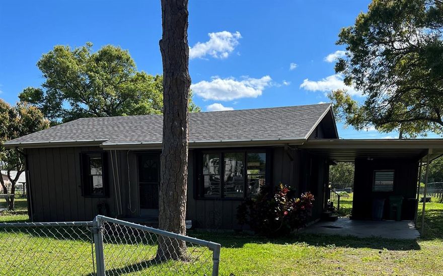 Zoning for property is industrial. Three bedroom home with new roof, large family room and outside deck, laminate flooring throughout and accordion shutters for a hassle free hurricane season.