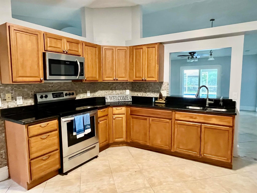 Photo of 2155 SW Azure Avenue, Port Saint Lucie, FL 34986 (MLS # R11010320)