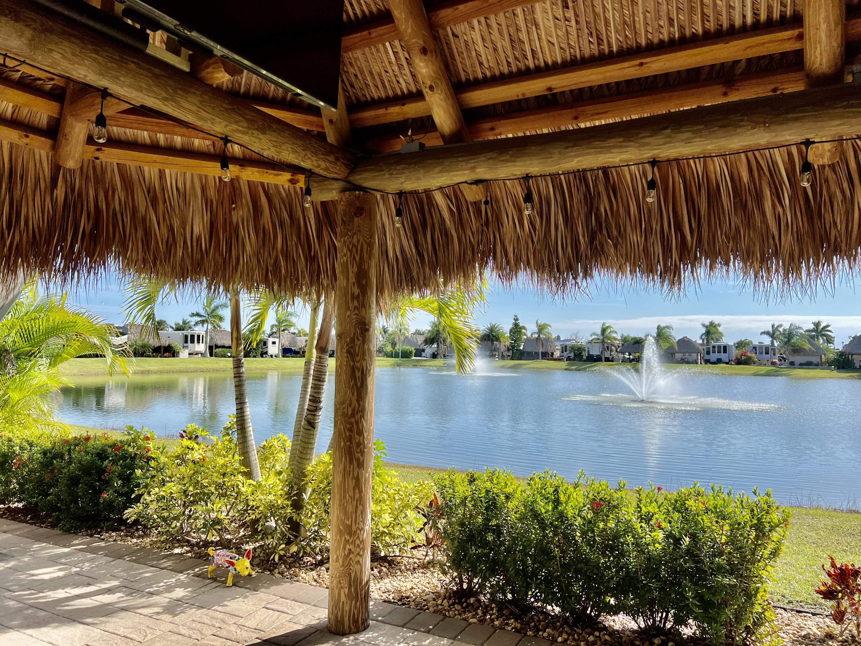 SILVER PALMS RV RESORT ~ Premier Lot 344 on Osprey Lake will accommodate a 45' Coach. Be captivated by the sounds of the fountains as you relax under the bistro lighted 12x16 Tiki Hut. Beautiful pavers and exquisite landscaping adorn this paradise. The 12x16 Casita offers extra sleeping, bath, loft storage and laundry room, as well as frig and microwave. This Class A facility has heated pool, pickle ball, pet run, and lots of activities, just to name a few. STAR STUDED! Call Today!
