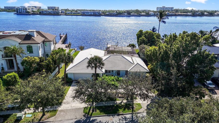 Experience unparalleled luxury with this exquisite direct Intracoastal pool home! Recently and meticulously renovated, this serene 3-bedroom, 2-bathroom gem offers 100 feet of prime water frontage and a private dock, making it an ideal haven for boating enthusiasts. Dive into the inviting pool, or unwind in the elegant living spaces featuring a gourmet kitchen with top-of-the-line appliances, marble flooring throughout, and bathrooms designed to resemble a spa retreat.This home boasts impact-resistant windows for added safety and peace of mind, a roof updated in 2014, and a brand-new A/C system for optimal comfort. The attention to detail and high-end finishes throughout embody true luxury living.