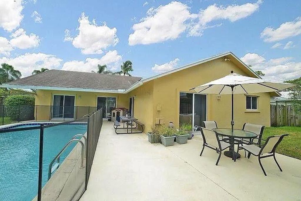 Photo of 3306 NW 28th Terrace, Boca Raton, FL 33434 (MLS # R10983857)