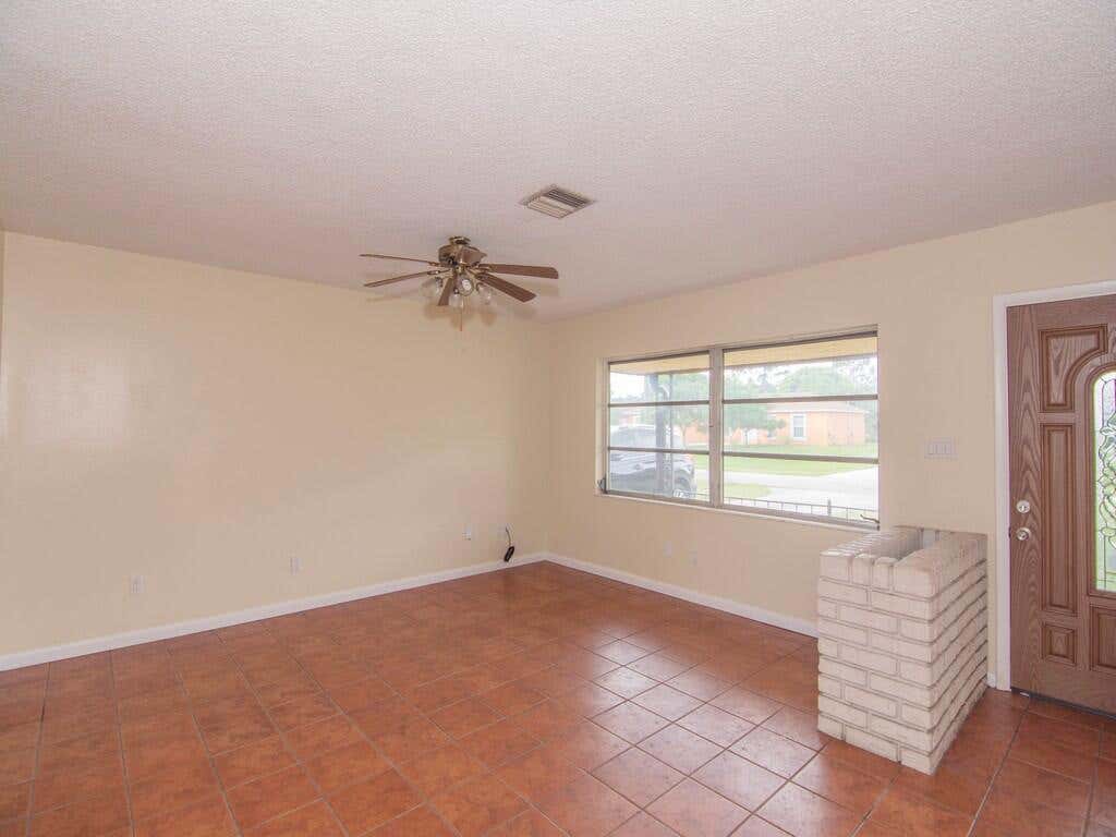 Photo of 557 SW Duval Avenue, Port Saint Lucie, FL 34983 (MLS # R11037227)