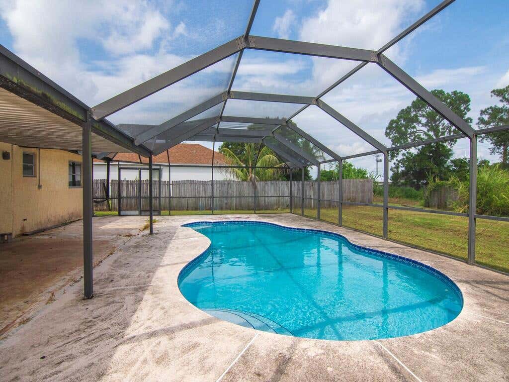 Photo of 557 SW Duval Avenue, Port Saint Lucie, FL 34983 (MLS # R11037227)
