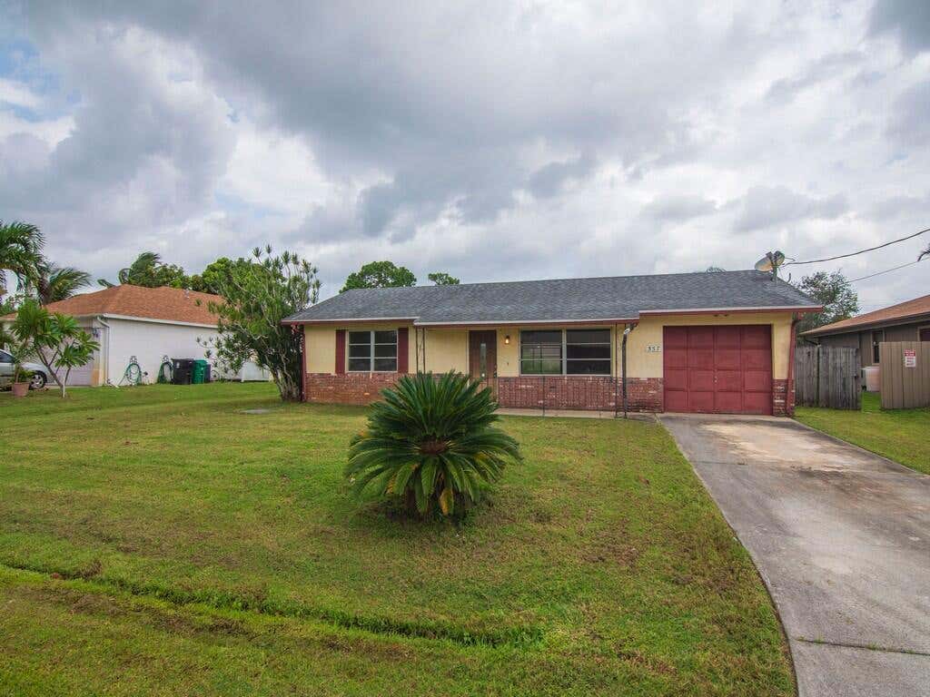 Photo of 557 SW Duval Avenue, Port Saint Lucie, FL 34983 (MLS # R11037227)