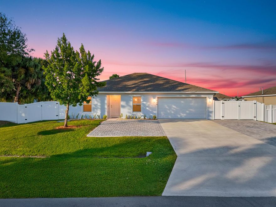 Built in 2021, this beautifully enhanced home offers inviting style and impressive upgrades throughout. Enjoy an extended paver driveway, a spacious screened and covered patio for effortless indoor-outdoor living, and a fully vinyl-fenced yard with dual drive gates for easy access to boats, trailers, or extra vehicles. Inside, seamless porcelain tile with epoxy grout adds elegance and durability, while the primary suite features a beautifully tiled walk-in shower. The garage stands out with a polyaspartic flake floor and premium Husky locking cabinets. A large shed with roll-up door and ramp provides excellent extra storage. A full Ring system with Floodlight Pros and doorbell cam adds comfort and peace of mind. This home delivers standout features and exceptional appeal.