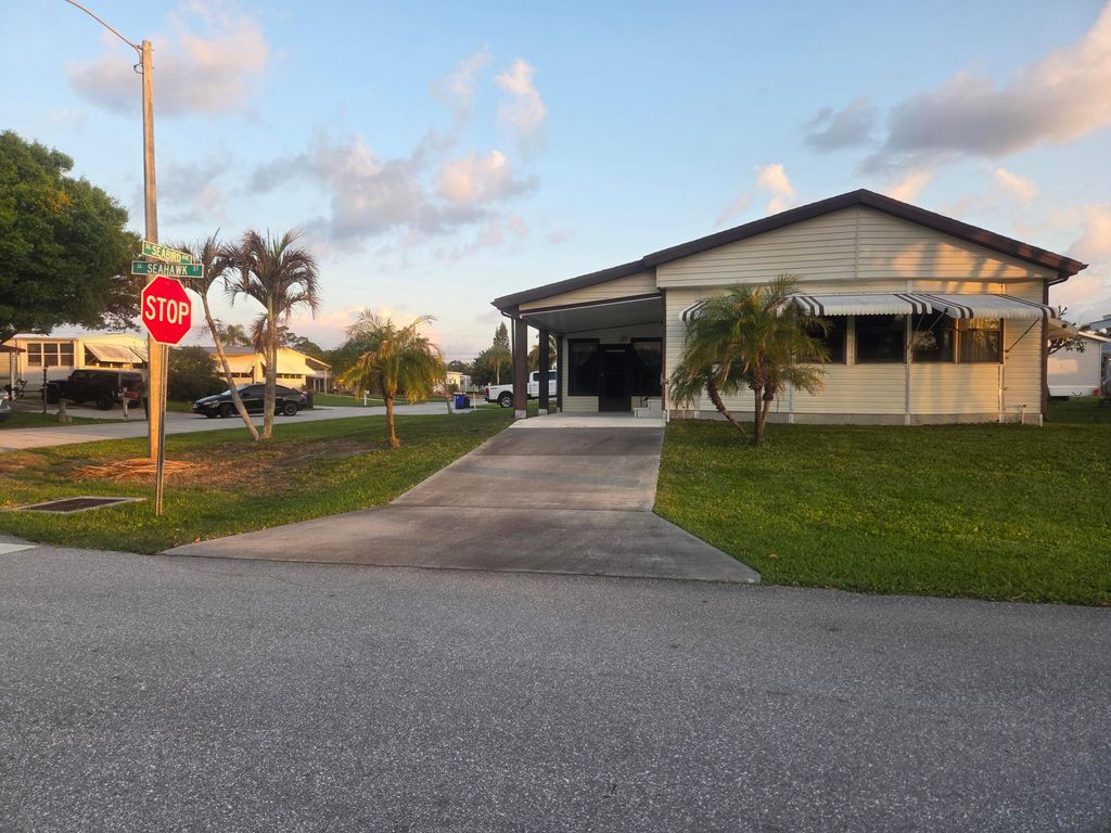 Photo of 7107 SE Seahawk Street, Hobe Sound, FL 33455 (MLS # B26007085)
