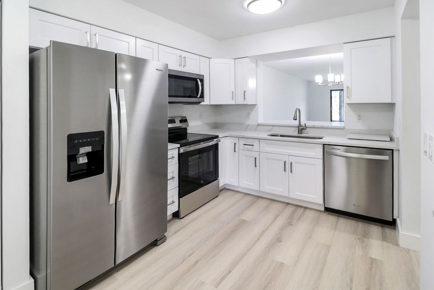 Gorgeous First Floor Condo in Huntington Lakes. This Home Must Be Seen! The Stunning Kitchen Includes Quartz Counters, White Wood Cabinets and New Stainless Steel Appliances. All New Modern Flooring Throughout. Beautiful Bathrooms. Relax on Your Enclosed Patio with Picturesque Water Views. All in an Incredible Amenity Rich Gated Active Adult Community with a Recently Redone Clubhouse with Activities to Fill Your Days!