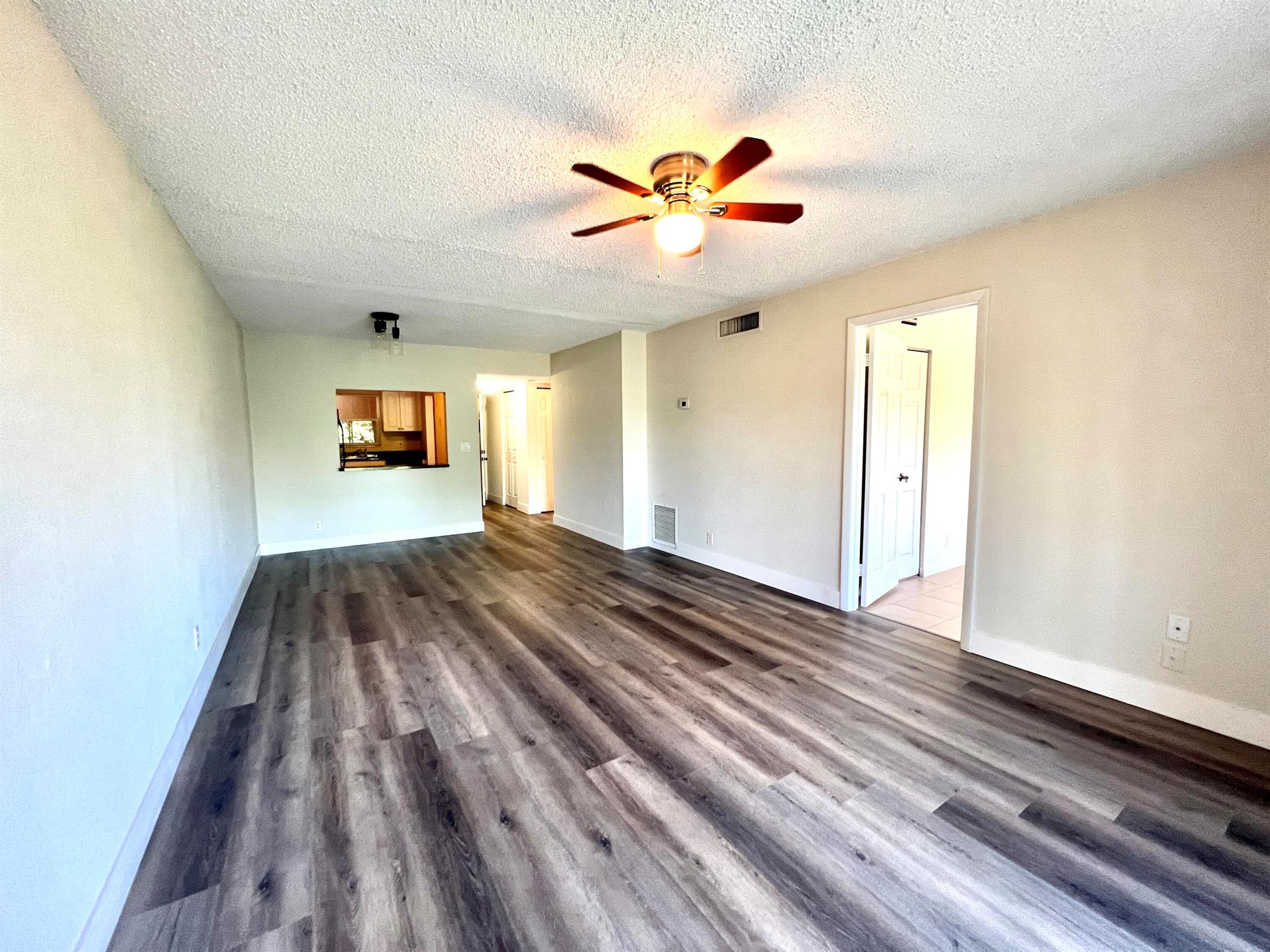 This Newly renovated condo is a prime opportunity to own a home in the desirable Park View at Palm Beach community. Centrally located near major highways, shopping, and restaurants, this beautifully updated unit features brand-new stainless steel appliances, vinyl flooring in common areas, freshly painted kitchen cabinets, and newly painted walls throughout. Enjoy a tranquil view from the screened-in balcony, which also connects to the master bedroom. Additional conveniences include an in-unit washer and dryer and a building elevator. Don't miss this incredible opportunity call today to schedule a showing!