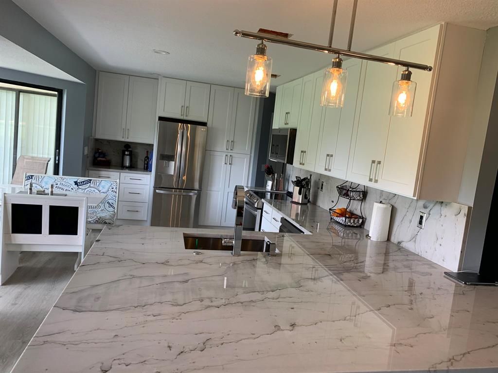 Photo of 5 E Lexington A Lane E #A, Palm Beach Gardens, FL 33418 (MLS # R10756475)