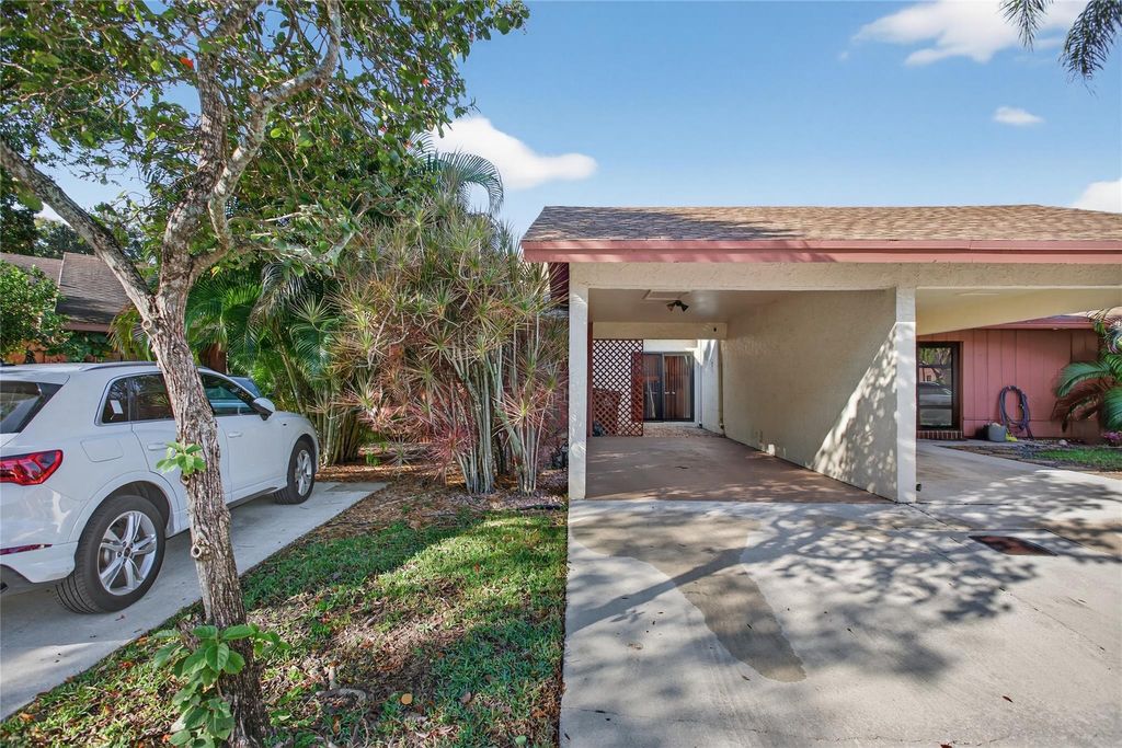 Photo of 1804 Tamarind Ln, Coconut Creek, FL 33063 (MLS # F10539613)