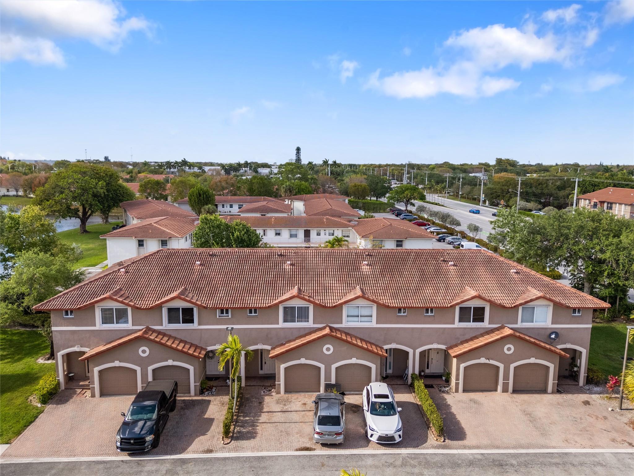 Move-in ready 3-bedroom, 2.5-bathroom townhome, conveniently situated near the Sawgrass Expressway, dining establishments, shopping centers, and entertainment venues. This two-story residence features a ground floor with a kitchen equipped with a new refrigerator and dishwasher, a half bath, and a combined living/dining room with access to a small patio through sliding doors. Ascending to the upper level, the primary bedroom offers an en-suite bathroom with double sinks, accompanied by two guest bedrooms sharing a full-size bathroom. The interior features ceramic and wood floors throughout. Completing the ensemble is a single-car garage, housing a new full-size washer and dryer for added convenience.