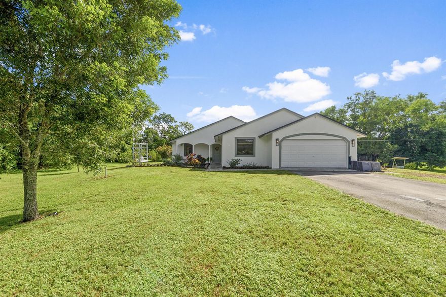 3 Bedroom, 2 Bath + Flex Room on 1.25 AcresThis beautifully updated home offers the perfect blend of modern upgrades and serene outdoor living.a Features & Upgradesa Brand new roof for peace of minda New kitchen with soft-close cabinets & white quartz countertopsa Luxurious marble master bathroom & updated guest bath- white herringbone tile and penny tile feature walla Partial impact windows with accordion shuttersa The best split floorplan layout for privacy & comfortY Outdoor Livinga Resurfaced pool with screen enclosurea Fenced-in backyard, perfect for pets & entertaininga Lush dry lot with mature fruit trees: mango, starfruit, guava, lemon, tangerine, lime, peach & avocadoa Located on a dead-end paved road with unde