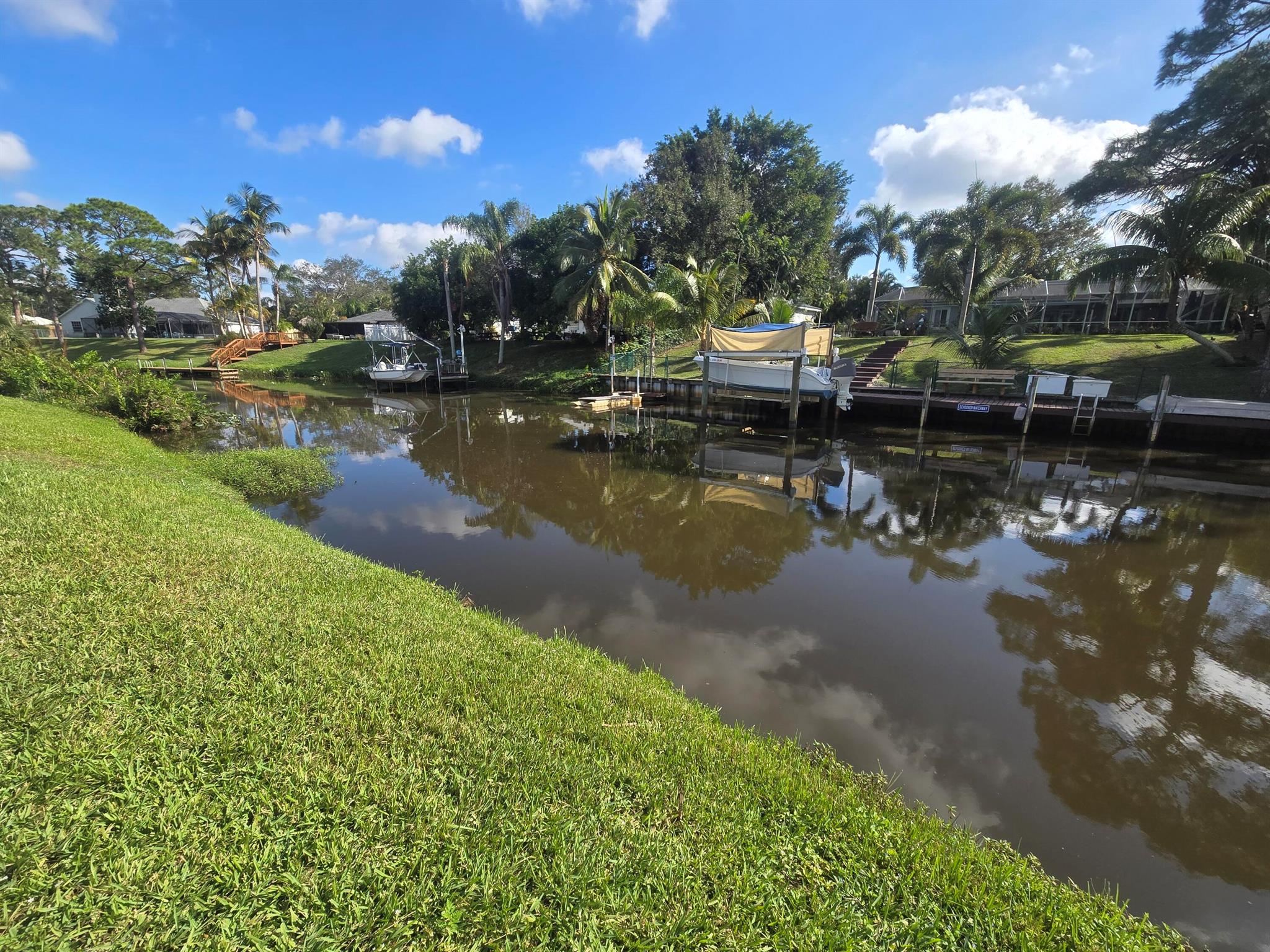 Own Your Slice of Paradise! Ocean Access Lot in Port St. Lucie! Don't miss the chance to own this High & Dry, OCEAN ACCESS waterfront lot in Port St. Lucie! This lot is already cleared, and is the perfect canvas to build your dream home. Imagine a luxurious, peaceful waterfront property, tucked into a neighborhood of lovely homes. Add a pool, dock, cabana... with no HOA restrictions, you have the freedom to bring your vision to life without limitations. Whether you're seeking a relaxing getaway or an entertainer's paradise, the possibilities are endless! Approx 40 minutes via boat to the ocean. Take the first step towards owning a piece of paradise. **Seller Motivated**