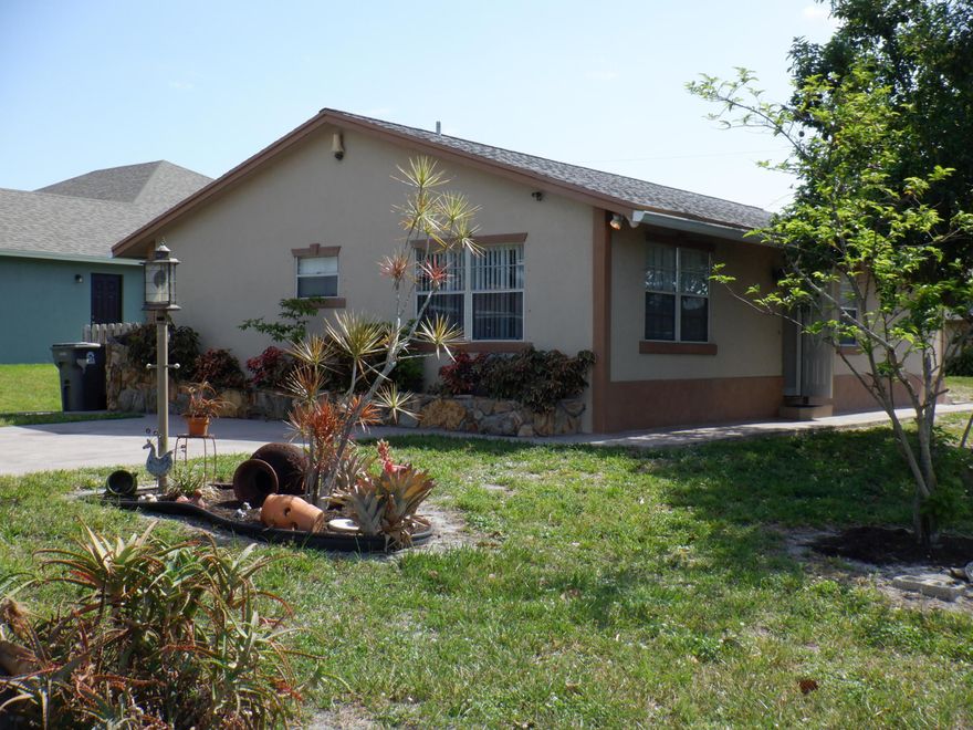 Lovely 3/2  single family home in the heart of West Palm Bch, immaculate and freshly painted home with large yard on quiet street.  Up to $400 rental credit for monthly electric and water bills included in monthly rent. Tenant is responsible for overages above $400, any amount over $400 will be added to and paid with monthly rent...Receipts will be provided.  1st, last and sec deposit, credit/background and proof of funds required.... a $400 monthly allowance included in monthly rent for power and water, Landscaping incl, no pets