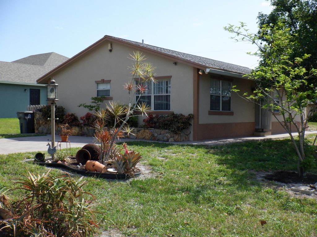 Photo of 1204 Sunset Road, West Palm Beach, FL 33406 (MLS # B26004414)