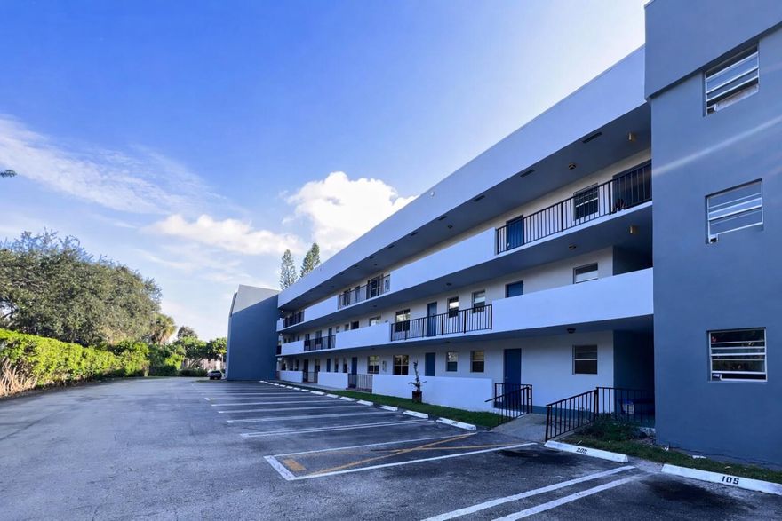 This home features bright, modern finishes throughout, including clean white and light-toned bathrooms and kitchen that create a fresh, inviting feel. The kitchen includes stainless steel appliances and light cabinetry, offering both style and functionality. The split-bedroom floor plan provides added privacy, with two walk-in closets for ample storage. Grey wood-plank flooring runs throughout the home, adding a contemporary touch and easy maintenance. Conveniently located near Downtown West Palm Beach, CityPlace, the beaches, Palm Beach Outlets, and major highways, this property offers easy access to shopping, dining, and entertainment.