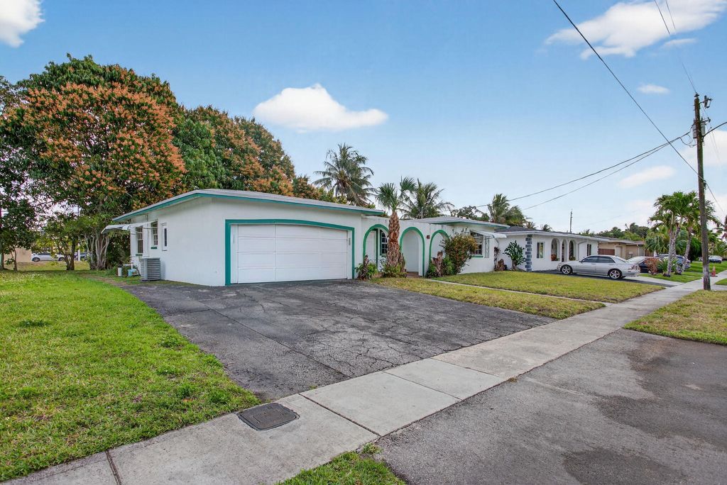 Photo of 2540 NW 34th Terrace, Lauderdale Lakes, FL 33311 (MLS # B26029251)
