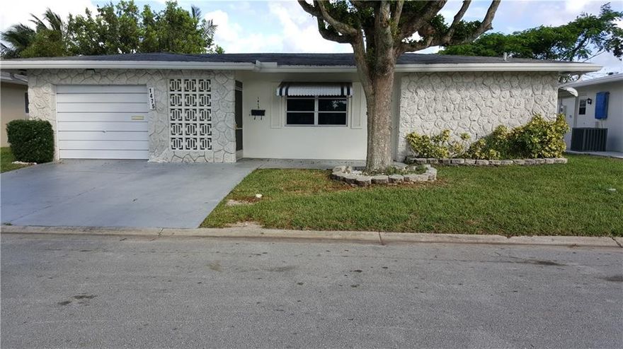 One of the best and talked about street on Paradise Gardens 111. I know - I live on the street.This a large model with loads of potential backing on to a beautiful canal with lots of wild life. The neighboring homes are upscale and can be nicked name "sold St" 2 Large bedrooms, 2 full baths, Formal Dining room, Florida room overlooks the canal.  From the Living Rm observe the Street and passers by.This incredible home has lots to offer is sold "AS IS"and priced right for a quick sale. Easy to show.