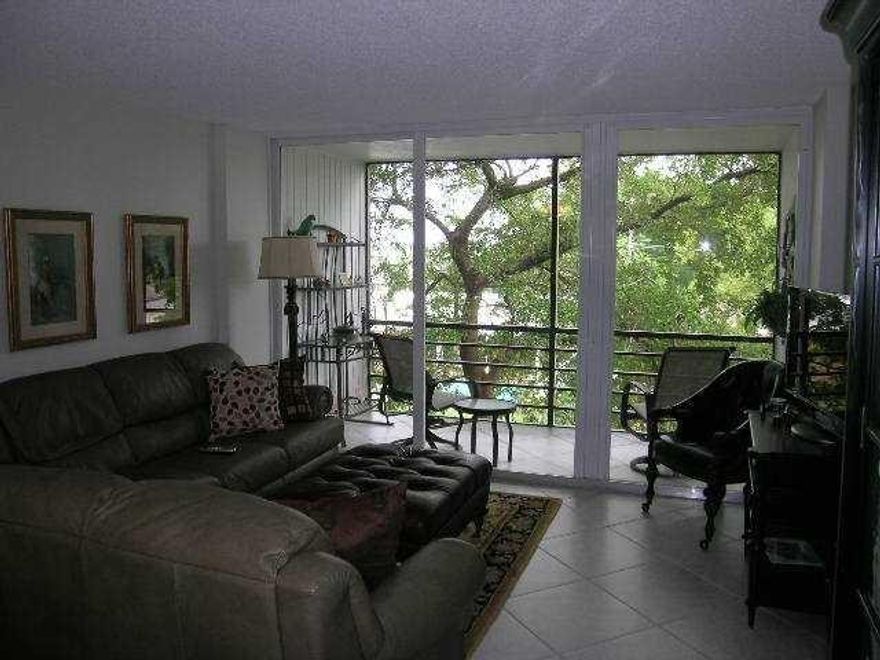 HURRICANE UPDATE: NO DAMAGE! Beautiful 2/2 located in well sought-after Royal Park Condos, guard-gated community. Newer kitchen w/ granite counters & stainless steel appliances, newer marble master bath & shower, new high-boy toilets, exhaust fans, & tempered glass shower doors in each bathroom. Murphy Bed Wall System in 2nd bedroom. Porcelain tile throughout. 4 ceiling fans, HURRICANE IMPACT WINDOWS, DOORS, & LARGE PATIO SLIDER. New wind/sun roll-down shutters & newer pet screening on canal view patio.