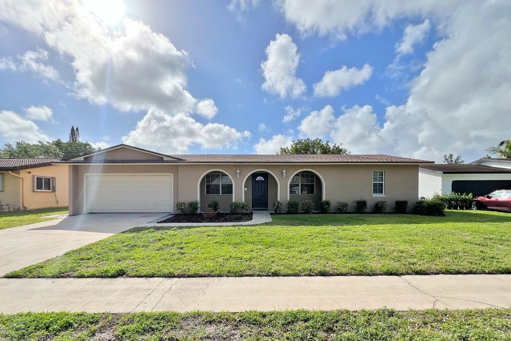 Photo of 260 Lake Drive, Coconut Creek, FL 33066 (MLS # B26011590)