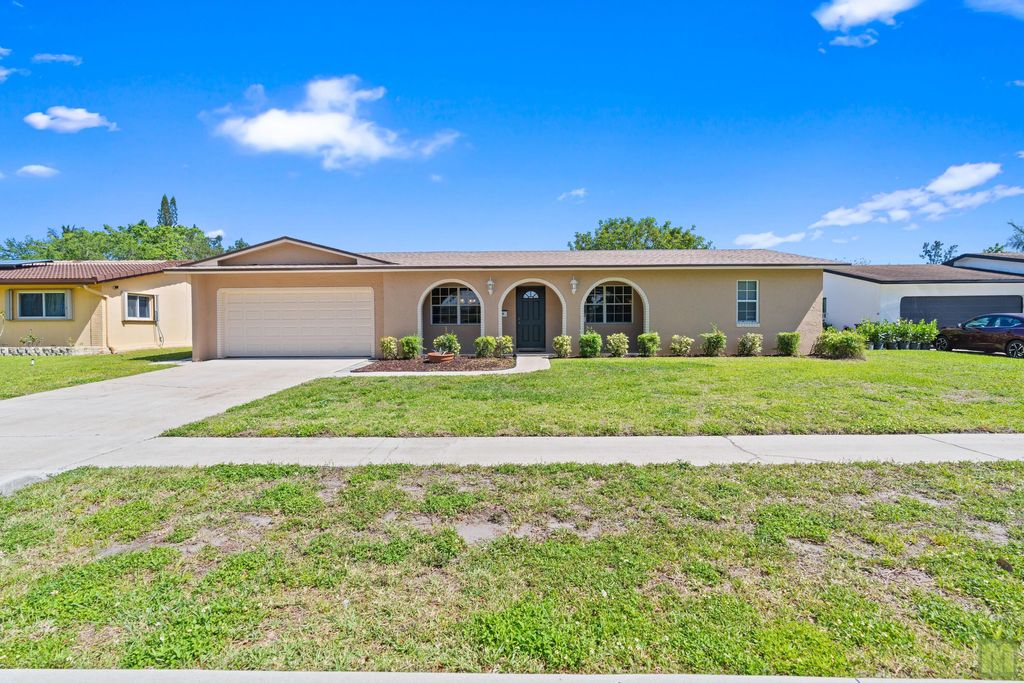 Photo of 260 Lake Drive, Coconut Creek, FL 33066 (MLS # B26011590)