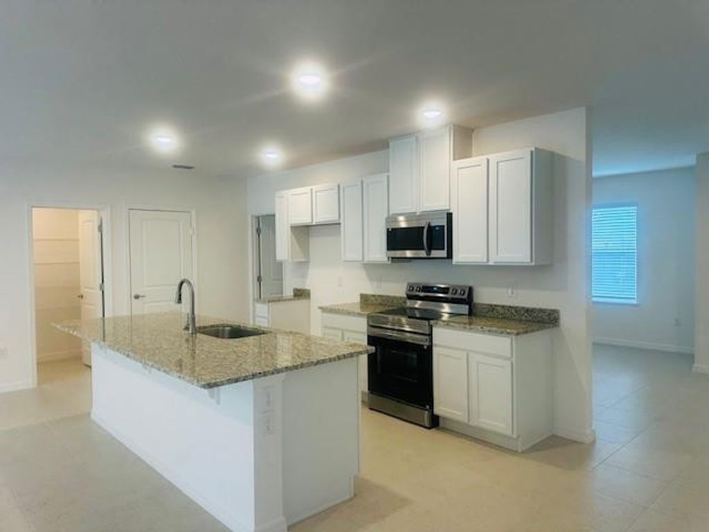 Photo of 2681 SW Eastman Street, Port Saint Lucie, FL 34953 (MLS # F10490936)