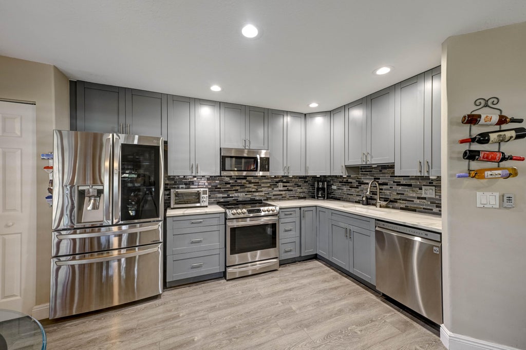 Photo of 4867 Pinemore Lane, Lake Worth, FL 33463 (MLS # B26090033)