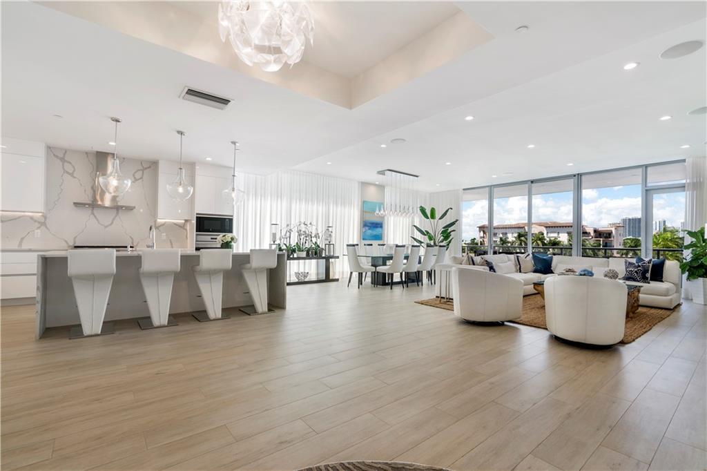 Sophisticated luxury inspired by ultra modern design contributes to the luxurious allure of this full-floor condo. The luminous open floor plan with 10’ ceilings, walls of glass onto 4 spacious balconies integrate indoor & outdoor living spaces boasting waterway & city skyline views. Conducive to today’s lifestyle with a culinary open kitchen, large center island, gas cooktop, wine refrigeration, Wolf & Subzero appliances, & oversized pantry. The grand master suite overlooks the waterway & features 2 custom walk-in closets. This unit can be sold completely furnished & comes with a 50’ boat slip, private rooftop terrace, & an electric vehicle parking spot. Minutes to restaurants, shopping, nightlife, & Fort Lauderdale Beach. Sq Ft from BCPA.