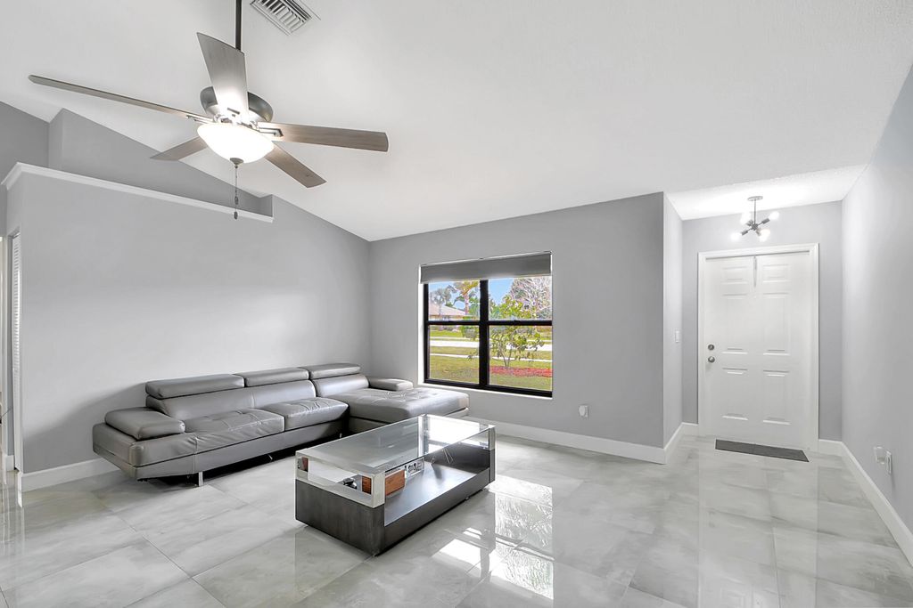 Photo of 7595 Woodland Creek Lane, Lake Worth Beach, FL 33467 (MLS # R10871144)