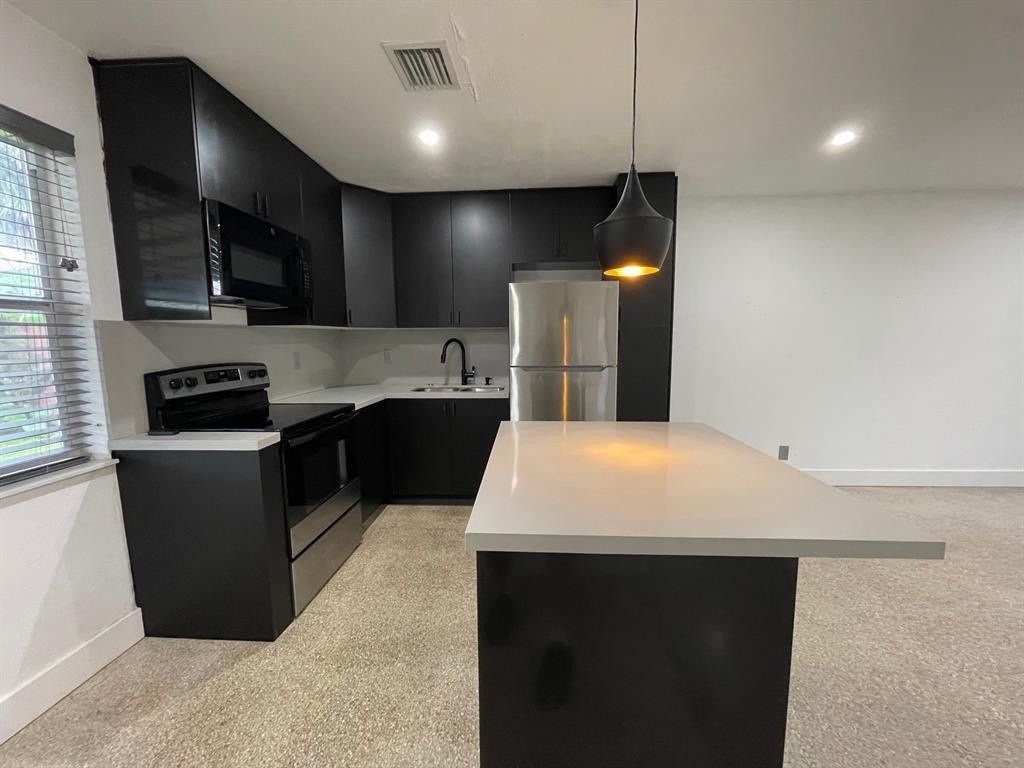 Photo of 975 NE 40th Street #A, Oakland Park, FL 33334 (MLS # F10551342)