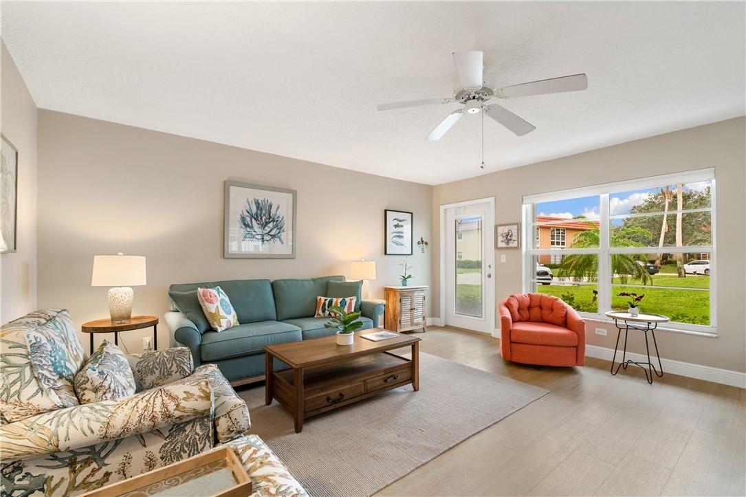Partially furnished andbBeautifully updated centrally located condo move-in ready! Updated kitchen with Quartzite countertops, crisp white cabinets and high end appliances, recessed lighting, under cabinet lighting. USB power outlets, impact glass door and accordion shutters. washer and dryer in unit. Active 55+ community w/pool, shuffleboard, tennis, pickleball, golf, and fun social calendar