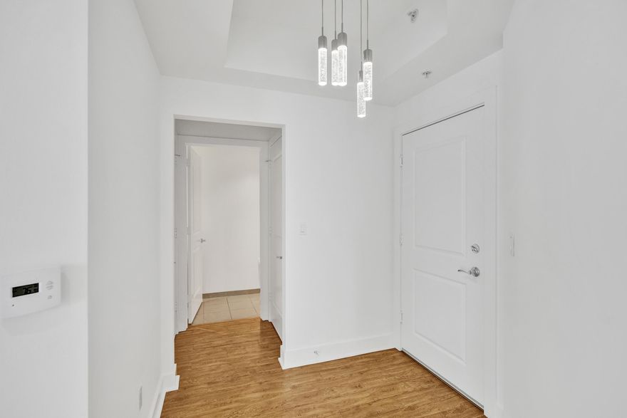 This beautifully recently painted corner unit comes with 2 assigned parking spaces and features 2 beds, 2.5 baths, open-concept living, a modern kitchen, floor-to-ceiling impact glass, high ceilings, and abundant natural light. Enjoy stunning downtown, city, and partial ocean views from the living area. The primary suite offers a large walk-in closet and a spa-style bathroom with double sinks, a soaking tub, and a separate shower. The guest bedroom includes a private bathroom and generous closet space. Prime location—walking distance to Downtown, Las Olas, Flagler Village, Brightline station, restaurants, and shops. Just 15 minutes to FLL Airport and the beach. Pet-friendly building with resort-style amenities: gym, pool with hot tub, clubhouse, business center, 24-hour front desk, EV cha