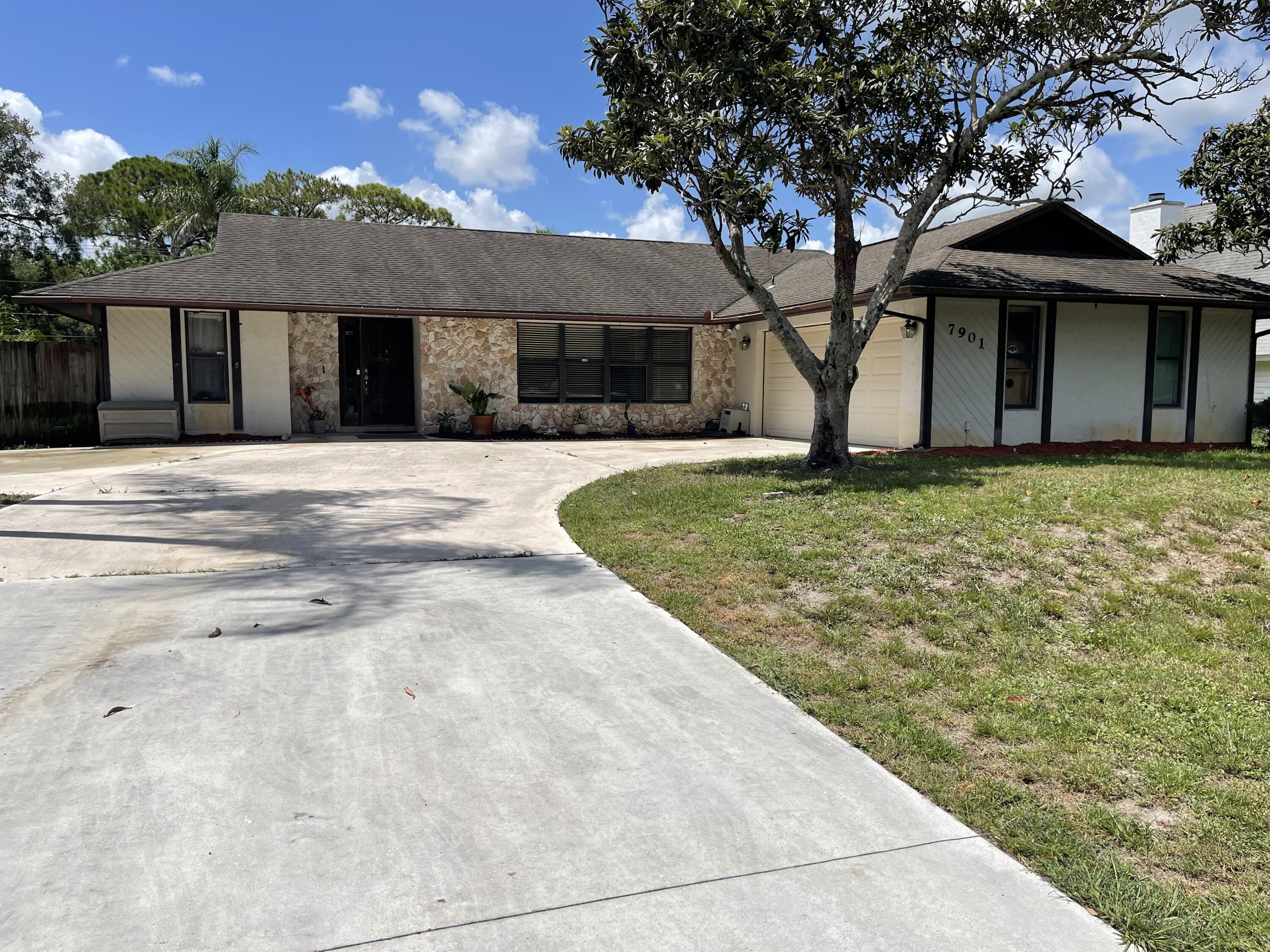 Beautiful custom 3BR/2BA CBS home in a peaceful bird sanctuary with no neighbors in front or behind. Features a split-bedroom layout, vaulted ceilings, skylight in guest bath, and bright open spaces. The primary suite includes a walk-in closet, en-suite bath, and sliding doors to the screened lanai and southern-exposure pool. Enjoy a chef's kitchen with granite, stainless appliances, island, and oversized pass-through window to the lanai with outdoor granite bar--perfect for entertaining. Includes a pool bath with private entry, whole-house vacuum, stone-accented front, 2-car garage with attic storage, extra-large water heater, and new septic drain field (2019). Lush lot with palm and fruit trees near lakes, parks, library, and fire station.