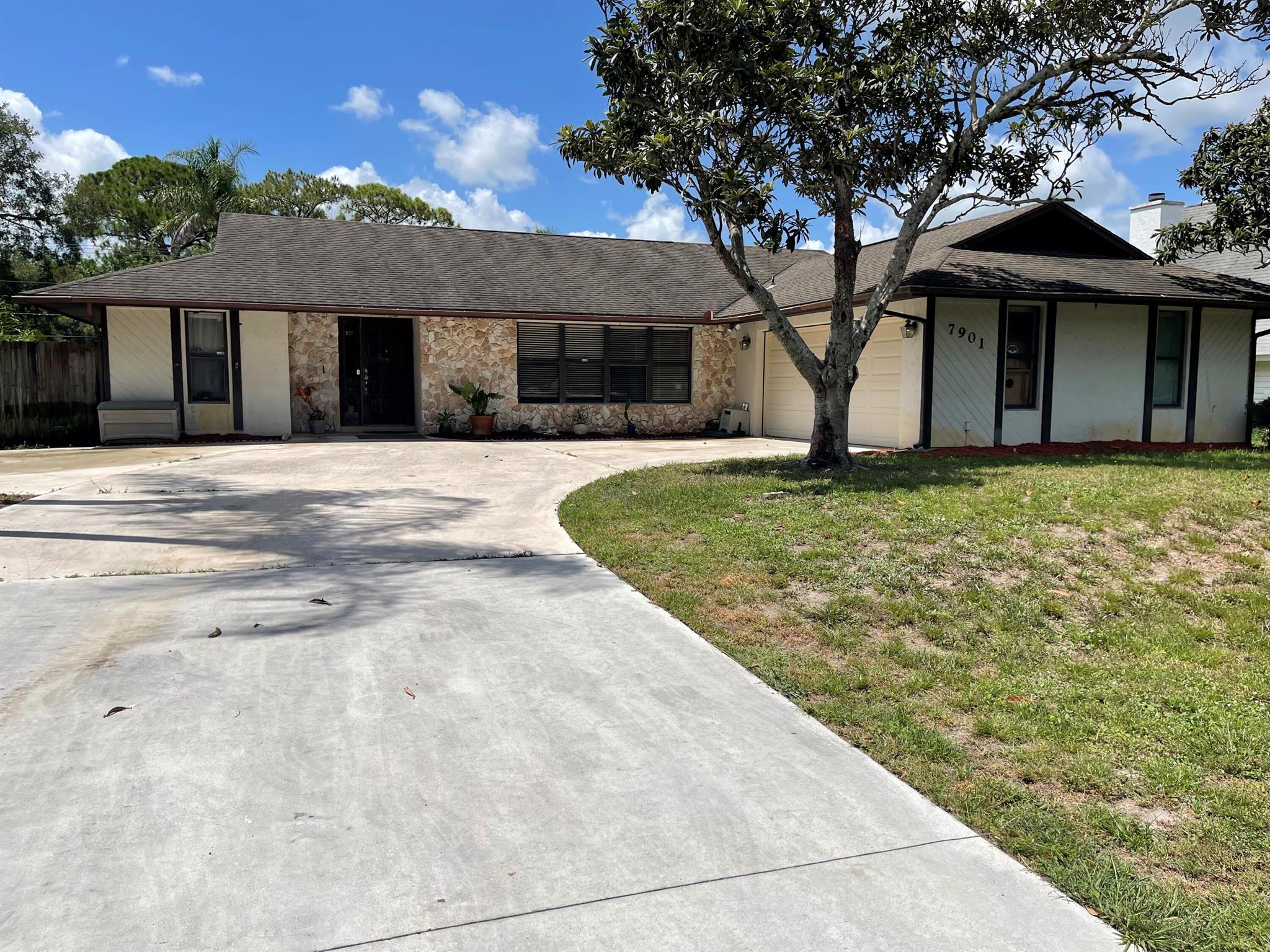 Beautiful custom 3BR/2BA CBS home in a peaceful bird sanctuary with no neighbors in front or behind. Features a split-bedroom layout, vaulted ceilings, skylight in guest bath, and bright open spaces. The primary suite includes a walk-in closet, en-suite bath, and sliding doors to the screened lanai and southern-exposure pool. Enjoy a chef's kitchen with granite, stainless appliances, island, and oversized pass-through window to the lanai with outdoor granite bar--perfect for entertaining. Includes a pool bath with private entry, whole-house vacuum, stone-accented front, 2-car garage with attic storage, extra-large water heater, and new septic drain field (2019). Lush lot with palm and fruit trees near lakes, parks, library, and fire station.