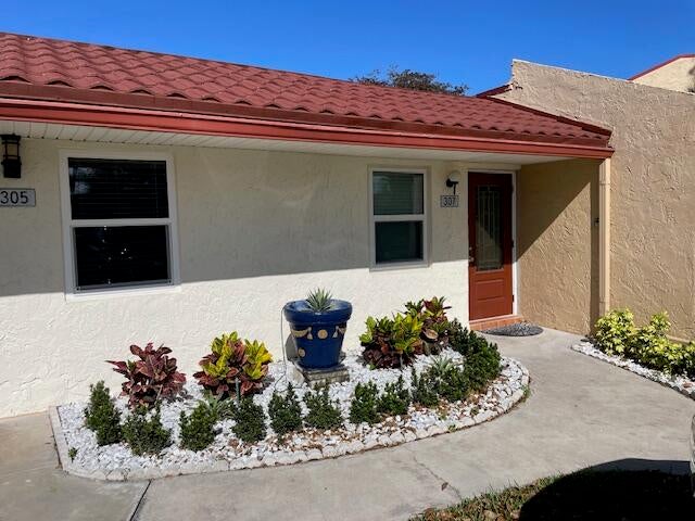 Photo of 307 LAKE EVELYN Drive, West Palm Beach, FL 33411 (MLS # B26074053)